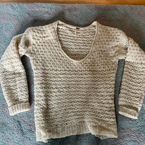 Cream colored Free People V-neck sweater. Oversized.